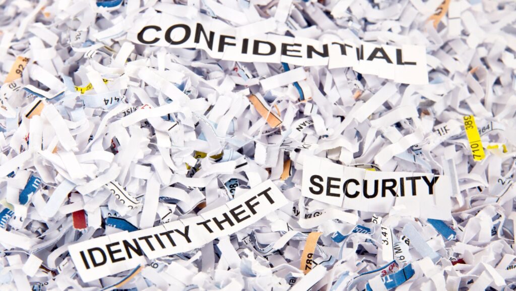 Close-up of shredded paper with the words - Confidential, Identity Theft, and Security.