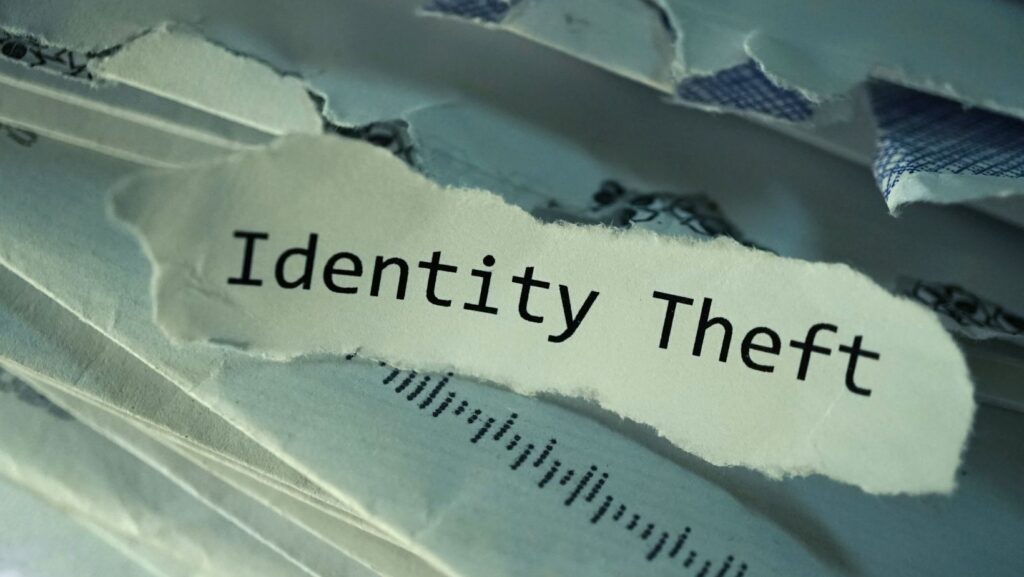 Ripped piece of paper that says "Identity Theft"